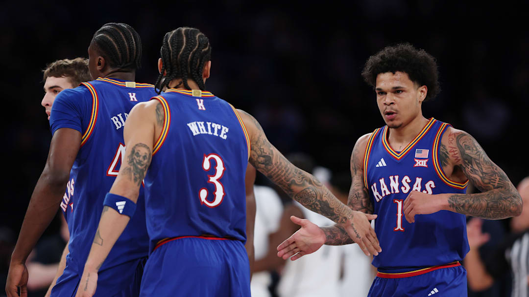Kansas basketball players Tre White (3) and Jayden Dawson (1) Kansas basketball players Tre White (3) and Jayden Dawson (1)