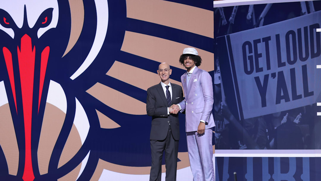 Jun 25, 2025; Brooklyn, NY, USA;  Asa Newell stands with NBA commissioner Adam Silver after being selected as the 23rd pick by the New Orleans Pelicans in the first round of the 2025 NBA Draft at Barclays Center. Mandatory Credit: Brad Penner-Imagn Images