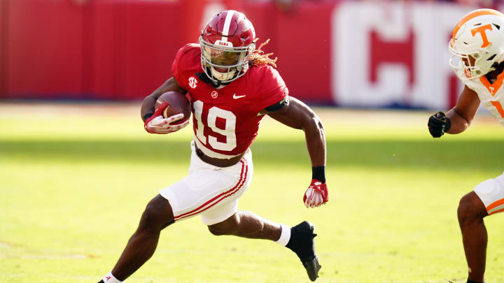 Oct 21, 2023; Tuscaloosa, Alabama, USA; Alabama Crimson Tide wide receiver Kendrick Law (19) carries up the field against the Tennessee Volunteers during the first half at Bryant-Denny Stadium. Mandatory Credit: John David Mercer-USA TODAY Sports