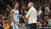 Feb 11, 2025; Phoenix, Arizona, USA; Memphis Grizzlies guard Ja Morant (12) talks with head coach Taylor Jenkins during the first half against the Phoenix Suns at Footprint Center. Mandatory Credit: Joe Camporeale-Imagn Images