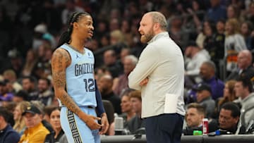 Feb 11, 2025; Phoenix, Arizona, USA; Memphis Grizzlies guard Ja Morant (12) talks with head coach Taylor Jenkins during the first half against the Phoenix Suns at Footprint Center. Mandatory Credit: Joe Camporeale-Imagn Images