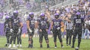 Oct 18, 2025; Fort Worth, Texas, USA; The TCU Horned Frogs offensive line stands on the field between plays against the Baylor Bears during the first half of a game at Amon G. Carter Stadium. Mandatory Credit: Raymond Carlin III-Imagn Images