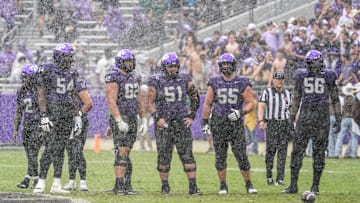 Oct 18, 2025; Fort Worth, Texas, USA; The TCU Horned Frogs offensive line stands on the field between plays against the Baylor Bears during the first half of a game at Amon G. Carter Stadium. Mandatory Credit: Raymond Carlin III-Imagn Images