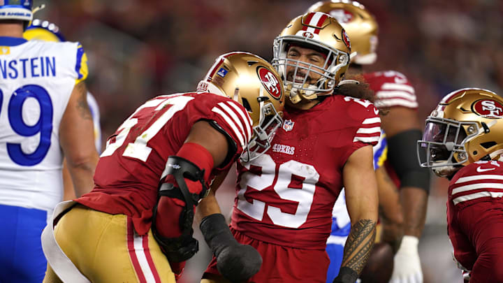 Dec 12, 2024; Santa Clara, California, USA; San Francisco 49ers linebacker Dre Greenlaw (57) is congratulated by safety Talanoa Hufanga (29) after making a tackle against the Los Angeles Rams in the first quarter at Levi's Stadium. Mandatory Credit: Cary Edmondson-Imagn Images