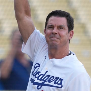 Jun 16, 2023; Los Angeles, California, USA; Billy Bean waves during LGBTQ+ Pride Night at Dodger Stadium. Mandatory Credit: Kirby Lee-USA TODAY Sports