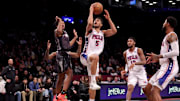Feb 12, 2025; Brooklyn, New York, USA; Philadelphia 76ers guard Quentin Grimes (5) drives to the basket against Brooklyn Nets guard Reece Beekman (4) during the fourth quarter at Barclays Center. Mandatory Credit: Brad Penner-Imagn Images