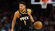 Apr 9, 2025; Phoenix, Arizona, USA; Phoenix Suns guard Devin Booker (1) dribbles the ball against the Oklahoma City Thunder during the first half at Footprint Center. Mandatory Credit: Mark J. Rebilas-Imagn Images