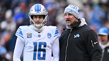 Dec 10, 2023; Chicago, Illinois, USA;  Detroit Lions head coach Dan Campbell talks with quarterback Jared Goff (16) in the first half against the Chicago Bears at Soldier Field. Mandatory Credit: Jamie Sabau-Imagn Images
