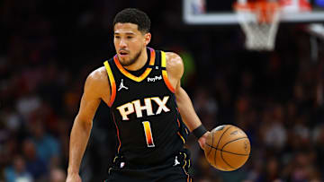 Apr 9, 2025; Phoenix, Arizona, USA; Phoenix Suns guard Devin Booker (1) dribbles the ball against the Oklahoma City Thunder during the first half at Footprint Center. Mandatory Credit: Mark J. Rebilas-Imagn Images