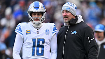 Dec 10, 2023; Chicago, Illinois, USA;  Detroit Lions head coach Dan Campbell talks with quarterback Jared Goff (16) in the first half against the Chicago Bears at Soldier Field. Mandatory Credit: Jamie Sabau-Imagn Images