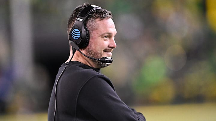 Dec 20, 2025; Eugene, OR, USA;  Oregon Ducks head coach Dan Lanning smiles during the third quarter against the James Madison Dukes at Autzen Stadium.