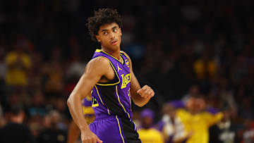 Oct 28, 2024; Phoenix, Arizona, USA; Los Angeles Lakers guard Max Christie (12) against the Phoenix Suns at Footprint Center. Mandatory Credit: Mark J. Rebilas-Imagn Images