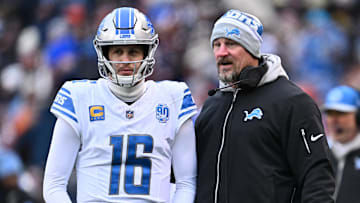 Dec 10, 2023; Chicago, Illinois, USA;  Detroit Lions head coach Dan Campbell talks with quarterback Jared Goff (16) in the first half against the Chicago Bears at Soldier Field. Mandatory Credit: Jamie Sabau-Imagn Images