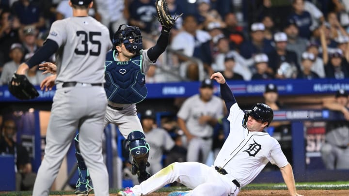 Aug 18, 2024; Williamsport, Pennsylvania, USA; Detroit Tigers infielder Colt Keith (33) slides home to score against New York Yankees catcher Austin Wells (28) in the ninth inning at BB&T Ballpark at Historic Bowman Field. Mandatory Credit: Kyle Ross-USA TODAY Sports