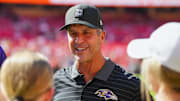 Sep 28, 2025; Kansas City, Missouri, USA; Baltimore Ravens head coach John Harbaugh talks to fans prior to a game against the Kansas City Chiefs at GEHA Field at Arrowhead Stadium. Mandatory Credit: Jay Biggerstaff-Imagn Images