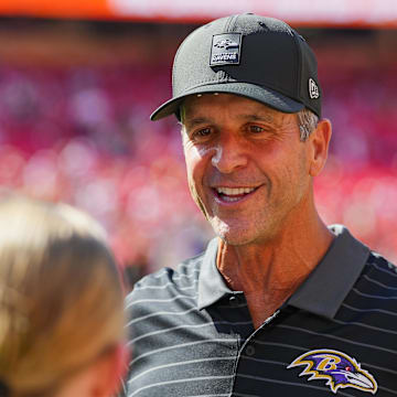 Sep 28, 2025; Kansas City, Missouri, USA; Baltimore Ravens head coach John Harbaugh talks to fans prior to a game against the Kansas City Chiefs at GEHA Field at Arrowhead Stadium. Mandatory Credit: Jay Biggerstaff-Imagn Images