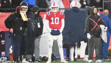 Dec 3, 2023; Foxborough, Massachusetts, USA; New England Patriots quarterback Mac Jones (10) watches