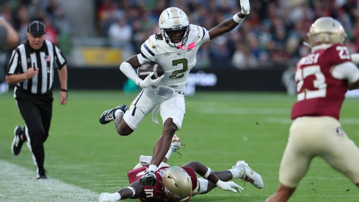 DJ Lundy of the Florida State Seminoles attempts to tackle Eric Singleton Jr of the Georgia Tech Yellow Jackets during the Aer Lingus College Football Classic game at Aviva Stadium on August 24, 2024 in Dublin, Ireland