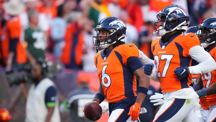 Oct 22, 2023; Denver, Colorado, USA; Denver Broncos safety P.J. Locke (6) reacts following his interception in the fourth quarter against the Green Bay Packers at Empower Field at Mile High. 