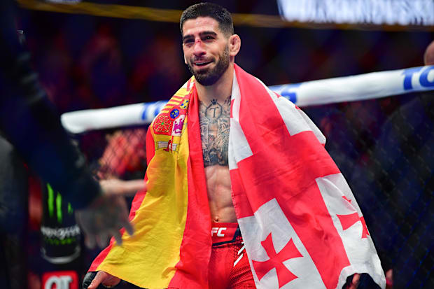 Ilia Topuria celebrates his championship victory against Alexander Volkanovski during UFC 298 at Honda Center. 