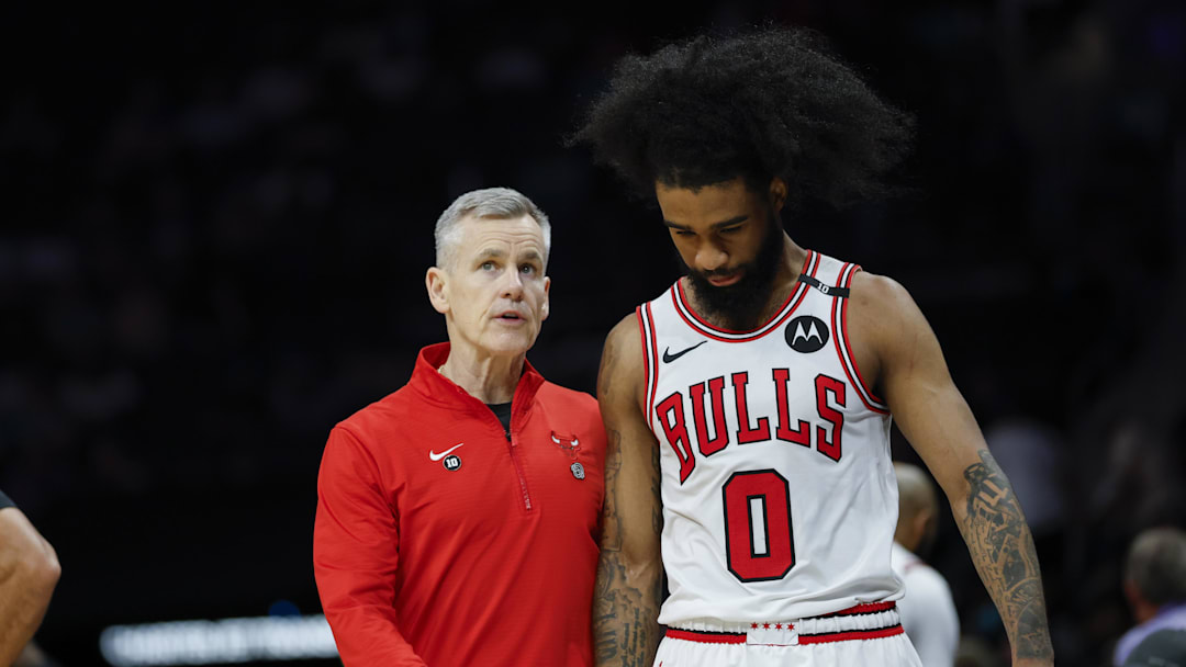 Apr 6, 2025; Charlotte, North Carolina, USA; Chicago Bulls head coach Billy Donovan talks to guard Coby White (0) during the second half against the Charlotte Hornets at Spectrum Center. Mandatory Credit: Nell Redmond-Imagn Images