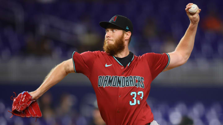 Aug 20, 2024; Miami, Florida, USA; Arizona Diamondbacks relief pitcher A.J. Puk (33) delivers a pitch against the Miami Marlins during the seventh inning at loanDepot Park. Mandatory Credit: Sam Navarro-USA TODAY Sports