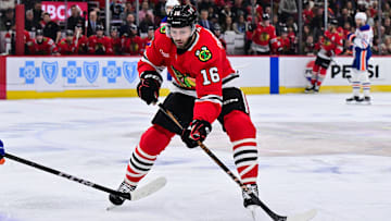 Feb 5, 2025; Chicago, Illinois, USA; Chicago Blackhawks center Jason Dickinson (16) plays the puck against the Edmonton Oilers during the first period at the United Center. Mandatory Credit: Daniel Bartel-Imagn Images