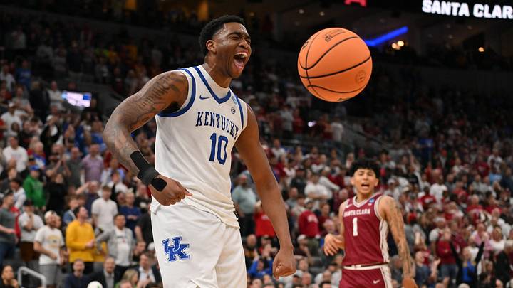Mar 20, 2026; St. Louis, MO, USA; Kentucky Wildcats forward Brandon Garrison (10) reacts after dunking the ball against Santa Clara Broncos guard Christian Hammond (1) during the overtime period of a first round game of the men's 2026 NCAA Tournament at Enterprise Center. Mandatory Credit: Jeff Curry-Imagn Images