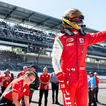 PREMA Racing driver Robert Shwartzman waves to the crowd after completing his run Sunday, May 18, 2025, during Top 12 qualifying for the 109th running of the Indianapolis 500 at Indianapolis Motor Speedway.