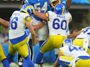 Aug 17, 2024; Inglewood, California, USA; Los Angeles Rams place kicker Joshua Karty (16) attempts a field goal against Los Angeles Chargers linebacker Savion Jackson (54) in the second half at SoFi Stadium. Mandatory Credit: Kirby Lee-Imagn Images