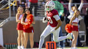 Nov 16, 2024; Stanford, California, USA;  Stanford Cardinal wide receiver Emmett Mosley V (10) runs in for a touchdown during the first quarter against the Louisville Cardinals at Stanford Stadium. Mandatory Credit: Bob Kupbens-Imagn Images