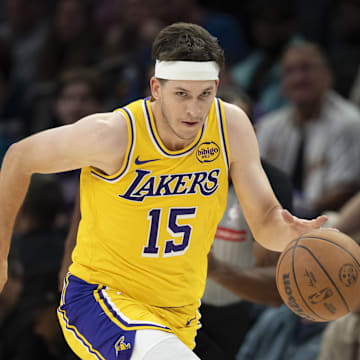 Oct 29, 2025; Minneapolis, Minnesota, USA; Los Angeles Lakers guard Austin Reaves (15) dribbles the ball against the Minnesota Timberwolves in the second half at Target Center. Mandatory Credit: Jesse Johnson-Imagn Images