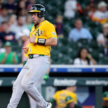 Jul 27, 2025; Houston, Texas, USA; Athletics catcher Austin Wynns (29) scores a run against the Houston Astros during the ninth inning at Daikin Park. Mandatory Credit: Erik Williams-Imagn Images