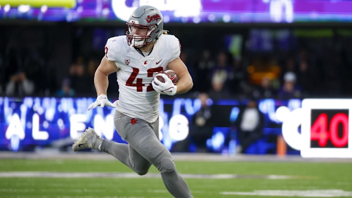 Nov 25, 2023; Seattle, Washington, USA; Washington State Cougars tight end Billy Riviere III (42) runs for yards after the catch against the Washington Huskies during the fourth quarter at Alaska Airlines Field at Husky Stadium. Mandatory Credit: Joe Nicholson-USA TODAY Sports