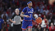 Mar 3, 2025; Houston, Texas, USA; Kansas Jayhawks guard Dajuan Harris Jr. (3) dribbles the ball during the first half against the Houston Cougars at Fertitta Center. Mandatory Credit: Troy Taormina-Imagn Images