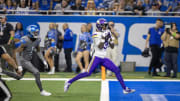 Jan 7, 2024; Detroit, Michigan, USA; Minnesota Vikings wide receiver Jordan Addison (3) catches a pass for a touchdown in front of Detroit Lions cornerback Cameron Sutton (1) during second half at Ford Field. Mandatory Credit: David Reginek-USA TODAY Sports