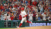 Sep 9, 2025; Philadelphia, Pennsylvania, USA; Fans react as Philadelphia Phillies outfielder Kyle Schwarber (12) runs the bases after hitting his 50th home run of the season during the seventh inning against the New York Mets at Citizens Bank Park.