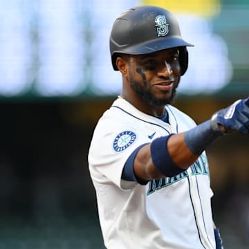 Seattle Mariners right fielder Victor Robles points to the Texas Rangers dugout during a game on Friday at T-Mobile Park.