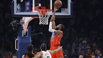 Nov 28, 2025; Oklahoma City, Oklahoma, USA; Oklahoma City Thunder guard Isaiah Joe (11) goes up for a basket against the Phoenix Suns during the second quarter at Paycom Center. Mandatory Credit: Alonzo Adams-Imagn Images