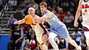 Mar 21, 2025; Milwaukee, WI, USA; Mississippi Rebels guard Sean Pedulla (3) and North Carolina Tar Heels guard Cade Tyson (5) chase a loose ball during the first half of a first round NCAA men’s tournament game at Fiserv Forum. Mandatory Credit: Jeff Hanisch-Imagn Images