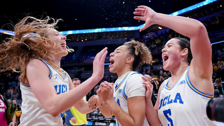 Mar 8, 2026; Indianapolis, IN, USA; UCLA Bruins guard Gianna Kneepkens (8), guard Kiki Rice (1) and guard Charlisse Leger-Walker (5) celebrate after defeating the Iowa Hawkeyes at Gainbridge Fieldhouse. Mandatory Credit: Robert Goddin-Imagn Images