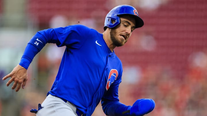 Jul 31, 2024; Cincinnati, Ohio, USA; Chicago Cubs designated hitter Cody Bellinger (24) scores on a sacrifice fly out hit by first baseman Patrick Wisdom (not pictured) in the third inning against the Cincinnati Reds at Great American Ball Park.