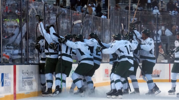 Jan 31, 2026; State College, PA, USA; The Michigan State Spartans celebrate their game-winning goal by Michigan State Spartans forward Charlie Stramel (15) against the Penn State Nittany Lions at Beaver Stadium. Mandatory Credit: James Lang-Imagn Images