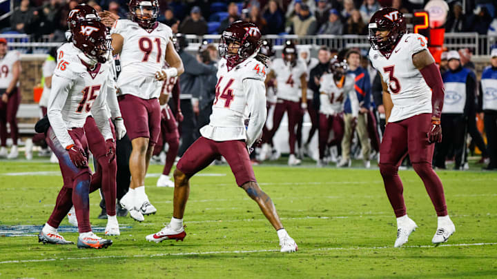 Virginia Tech Hokies cornerback Dorian Strong celebrates an interception with teammates during the second half of the game against Duke Blue Devils. Virginia Tech Hokies cornerback Dorian Strong celebrates an interception with teammates during the second half of the game against Duke Blue Devils.