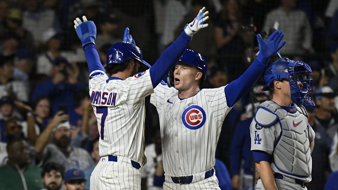 Apr 22, 2025; Chicago, Illinois, USA;  Chicago Cubs outfielder Pete Crow-Armstrong (4) celebrates with Chicago Cubs shortstop Dansby Swanson (7)  after they score on his two run home run during the fifth inning against the Los Angeles Dodgers at Wrigley Field. Matt Marton-Imagn Images