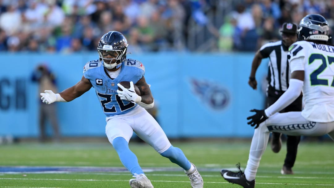 Nov 23, 2025; Nashville, Tennessee, USA; Tennessee Titans running back Tony Pollard (20) runs after a catch during the second half against the Seattle Seahawks at Nissan Stadium. Mandatory Credit: Steve Roberts-Imagn Images