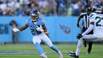 Nov 23, 2025; Nashville, Tennessee, USA; Tennessee Titans running back Tony Pollard (20) runs after a catch during the second half against the Seattle Seahawks at Nissan Stadium. Mandatory Credit: Steve Roberts-Imagn Images