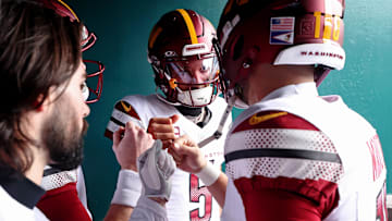 Jan 26, 2025; Philadelphia, PA, USA; Washington Commanders quarterback Jayden Daniels (5) huddles with teammates before the NFC Championship game at Lincoln Financial Field. Mandatory Credit: Bill Streicher-Imagn Images