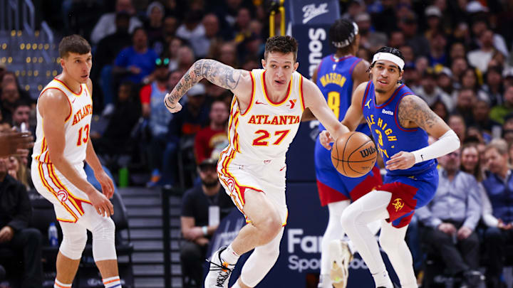 Apr 6, 2024; Denver, Colorado, USA; Atlanta Hawks guard Vit Krejci (27) drives down the court against the Denver Nuggets in the second half at Ball Arena. Mandatory Credit: Michael Ciaglo-Imagn Images