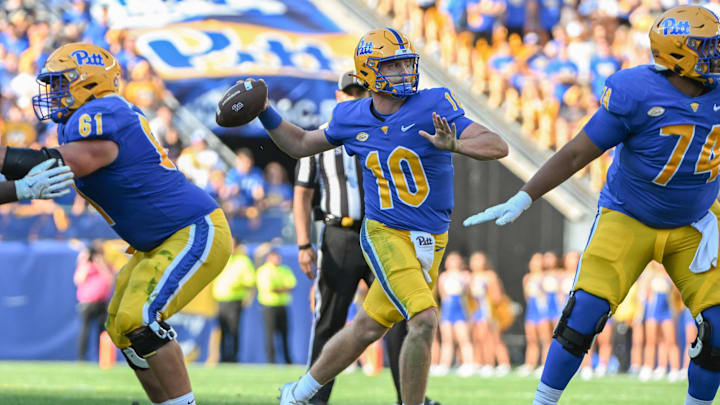 Sep 14, 2024; Pittsburgh, Pennsylvania, USA; Pittsburgh Panthers quarterback Eli Holstein (10) throws a touchdown pass against the West Virginia Mountaineers during the second quarter at Acrisure Stadium. Mandatory Credit: Barry Reeger-Imagn Images